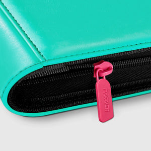 Close-up of the zipper pull and leather edge stitching on a green Venusaur Pokemon card binder