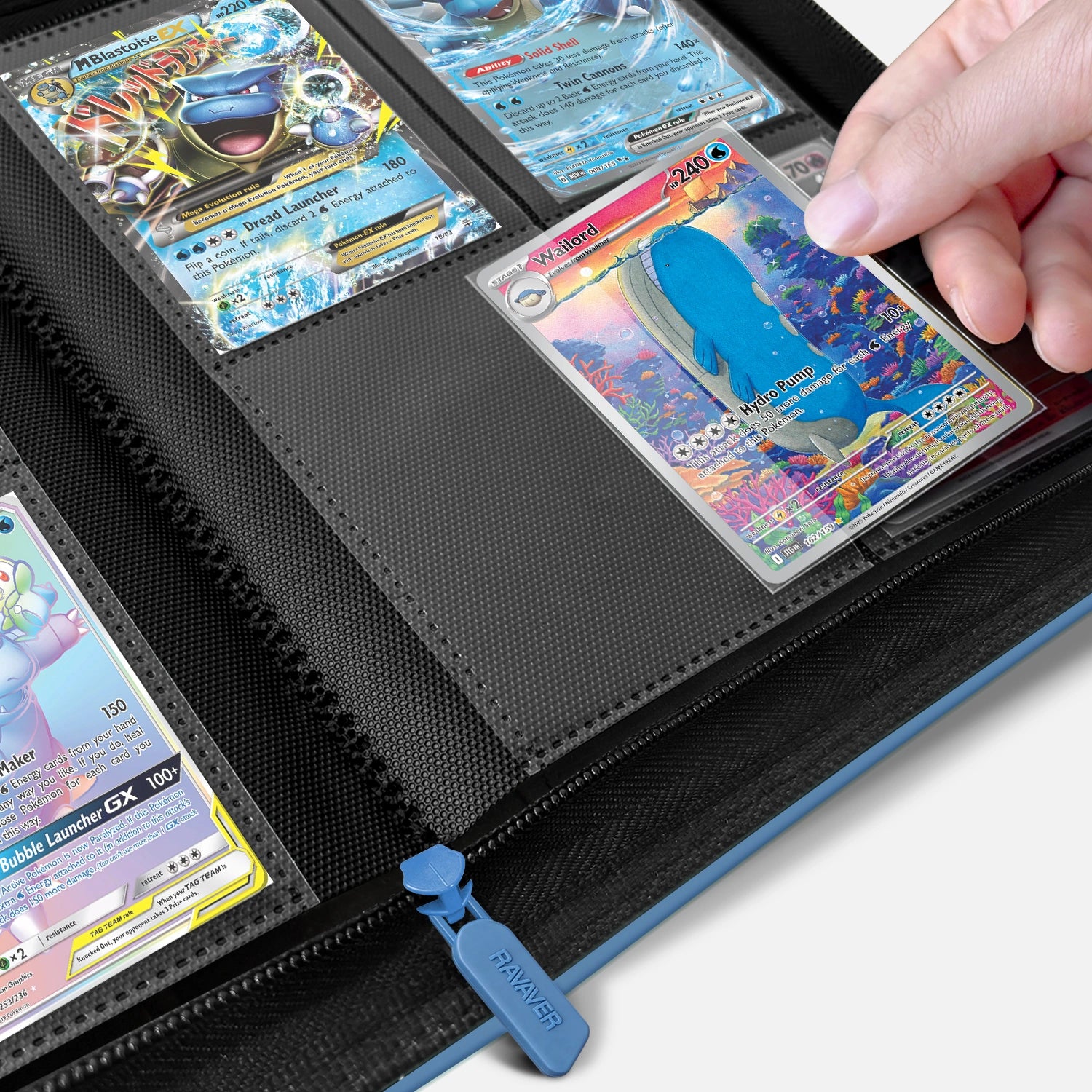 Hand placing a holographic Blastoise card into a crystal-clear pocket on an open blue 4-pocket Pokemon card binder
