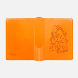 Orange Pokemon card binder laid open showing the embossed Charizard inner cover