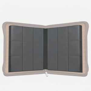 Interior view of a white Pokemon toploader binder with empty 9-pocket pages and 252-card capacity