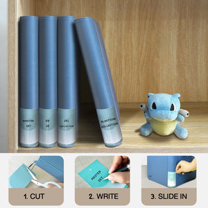 Customizable spine label inserts with cut, write, and slide-in steps beside a Squirtle plush for labeling a Pokemon card binder