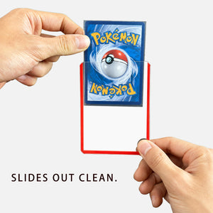 Hands sliding a trading card out of a red-edge toploader, showing the smooth seamless lip that keeps the card from catching
