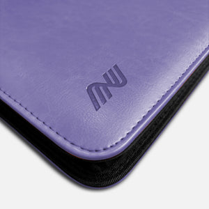 Close-up of embossed logo on purple leather Pokemon toploader binder corner with stitching