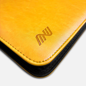 Close-up of embossed Pikachu and edge stitching on yellow leather toploader binder corner
