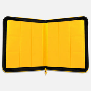 Interior of a yellow Pikachu Face card binder showing empty yellow 9-pocket pages and a lightning-bolt zipper pull