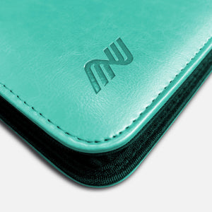 Close-up of the embossed logo and stitching on a green leather Pokemon card binder corner