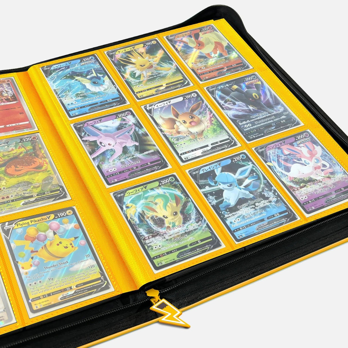 Open yellow Pikachu Face card binder with 9-pocket pages filled with holographic Pokemon cards