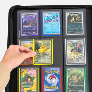 Color-edge toploaders loaded into a black toploader binder page, with a hand pulling one yellow-edge card out