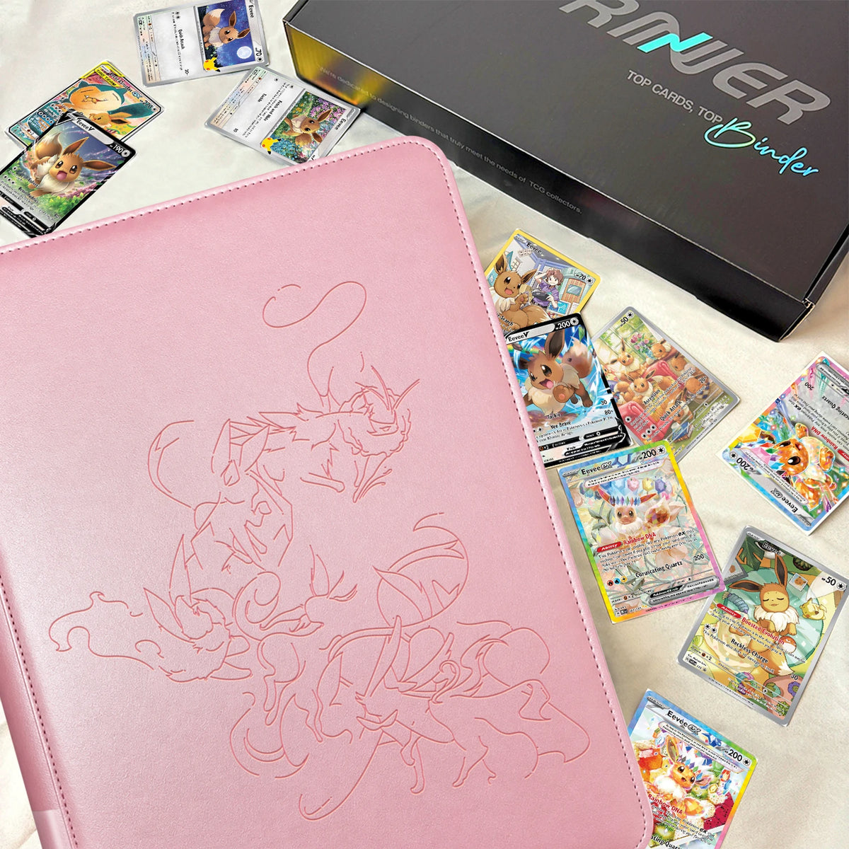 Pink Eevee Family card binder with Eevee family Pokemon cards and a black gift box