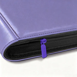 Close-up of purple zipper pull on Pokemon toploader binder with leather edge stitching